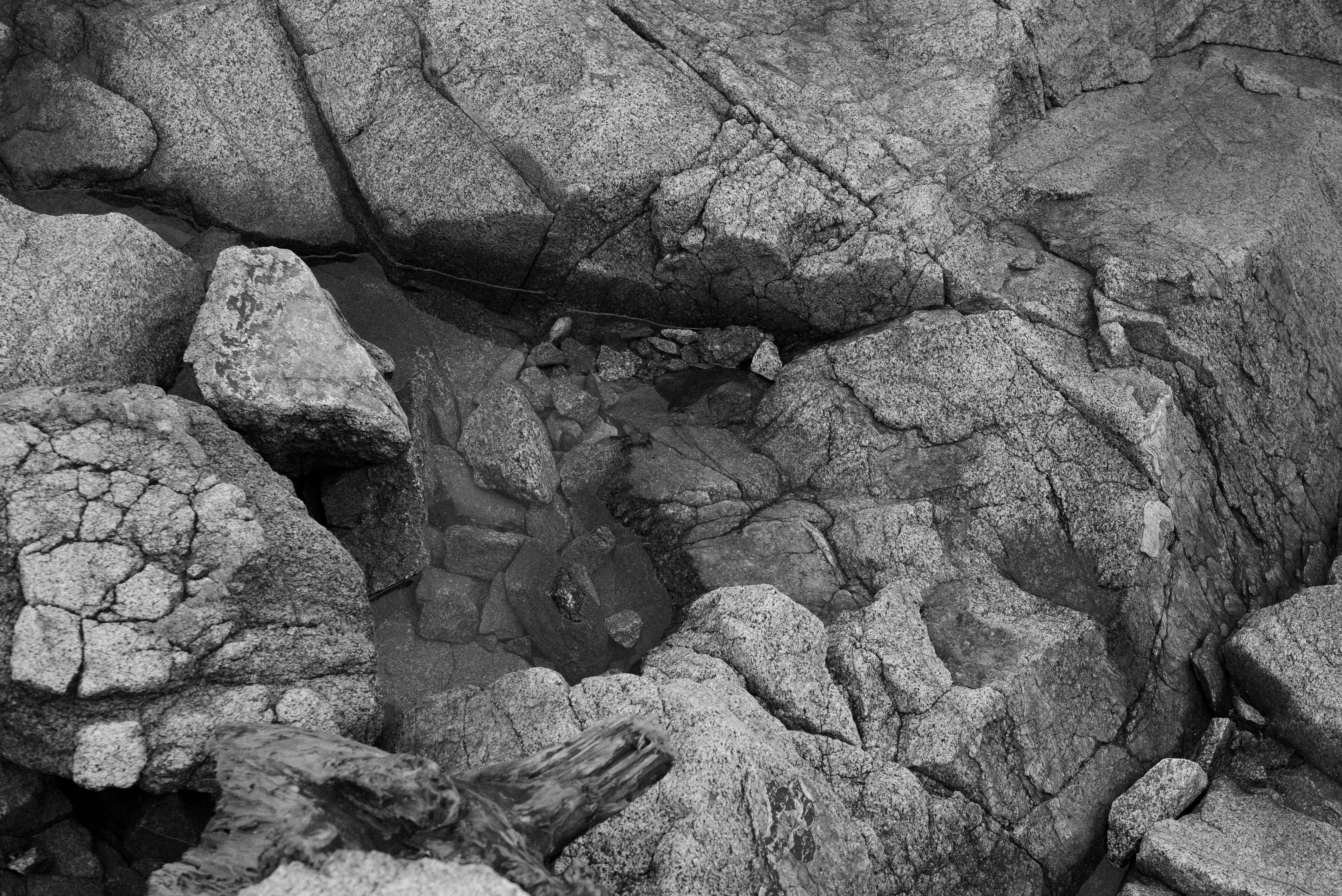 gray scale photo of rock formation